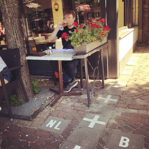 Subtle border markers on pavement illustrating how the boundary is both present and hard to see.