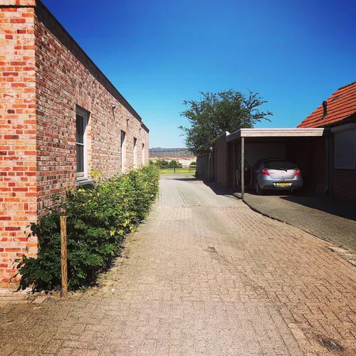 Residential street where the border line for Dutch counter-exclave N1 runs between houses.