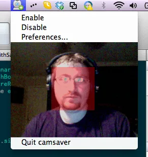 Webcam view of Ryan Lopopolo with a translucent red face-detection rectangle over his face.